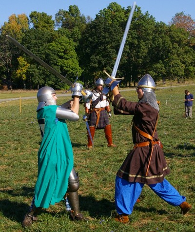 Grinning, the two squires battle it out.