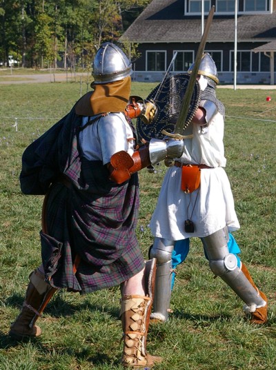 Squire Kale hides behind his shield as Angus Fraser lands a solid blow.