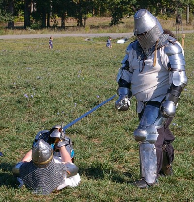 Squire Kale attempts to continue to fight Rhys McGregor despite being on the ground.