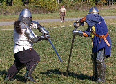 Rhys McGregor battles Sir Michael with great swords.